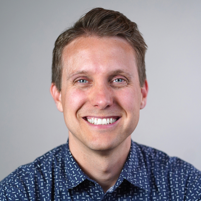 A professional headshot of Doug Wilson, the author, smiling at the camera.